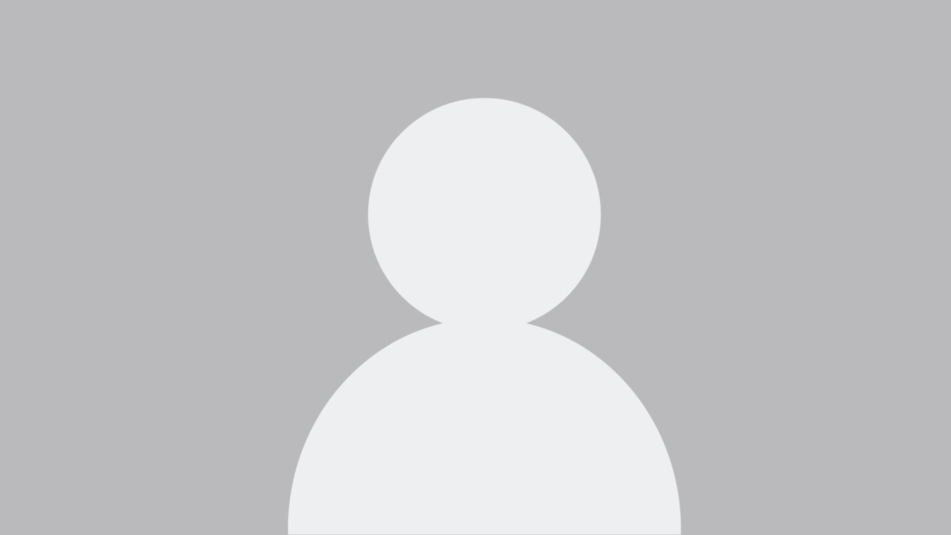 portrait photography of man wearing black suit jacket